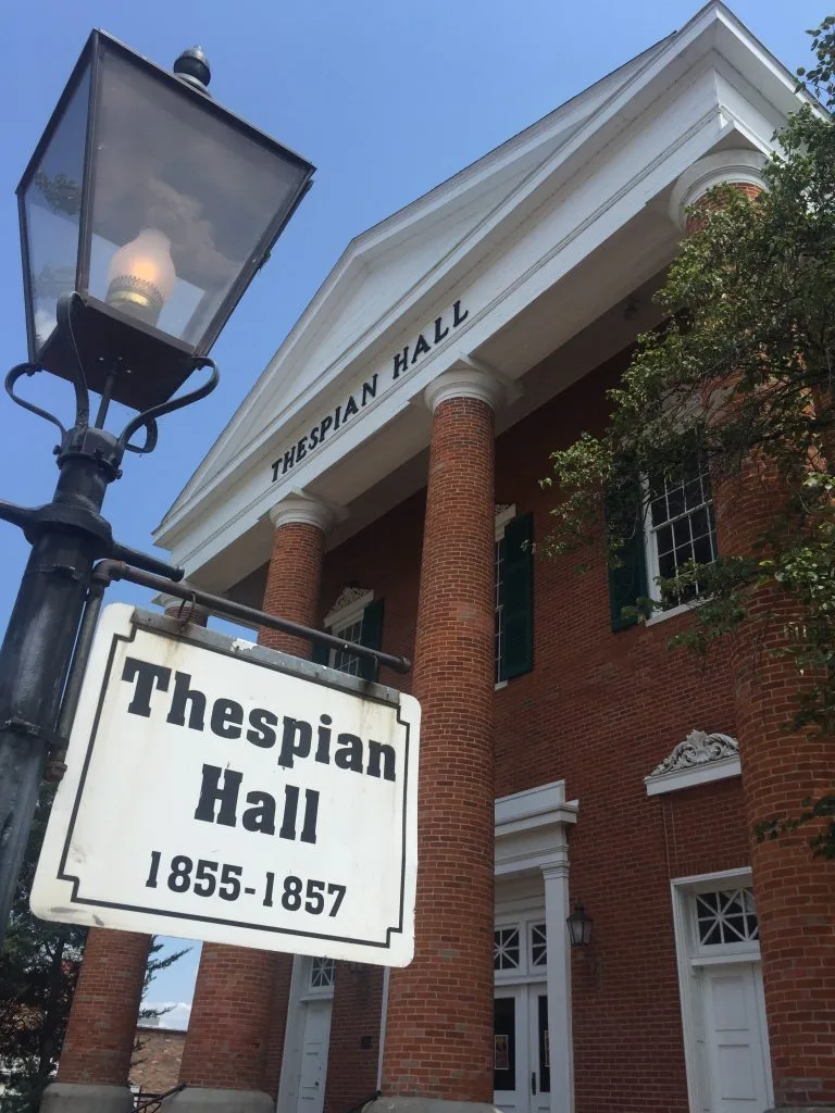 The brick columned facade of historic Thespian Hall in downtown Boonville, built 1855-1857